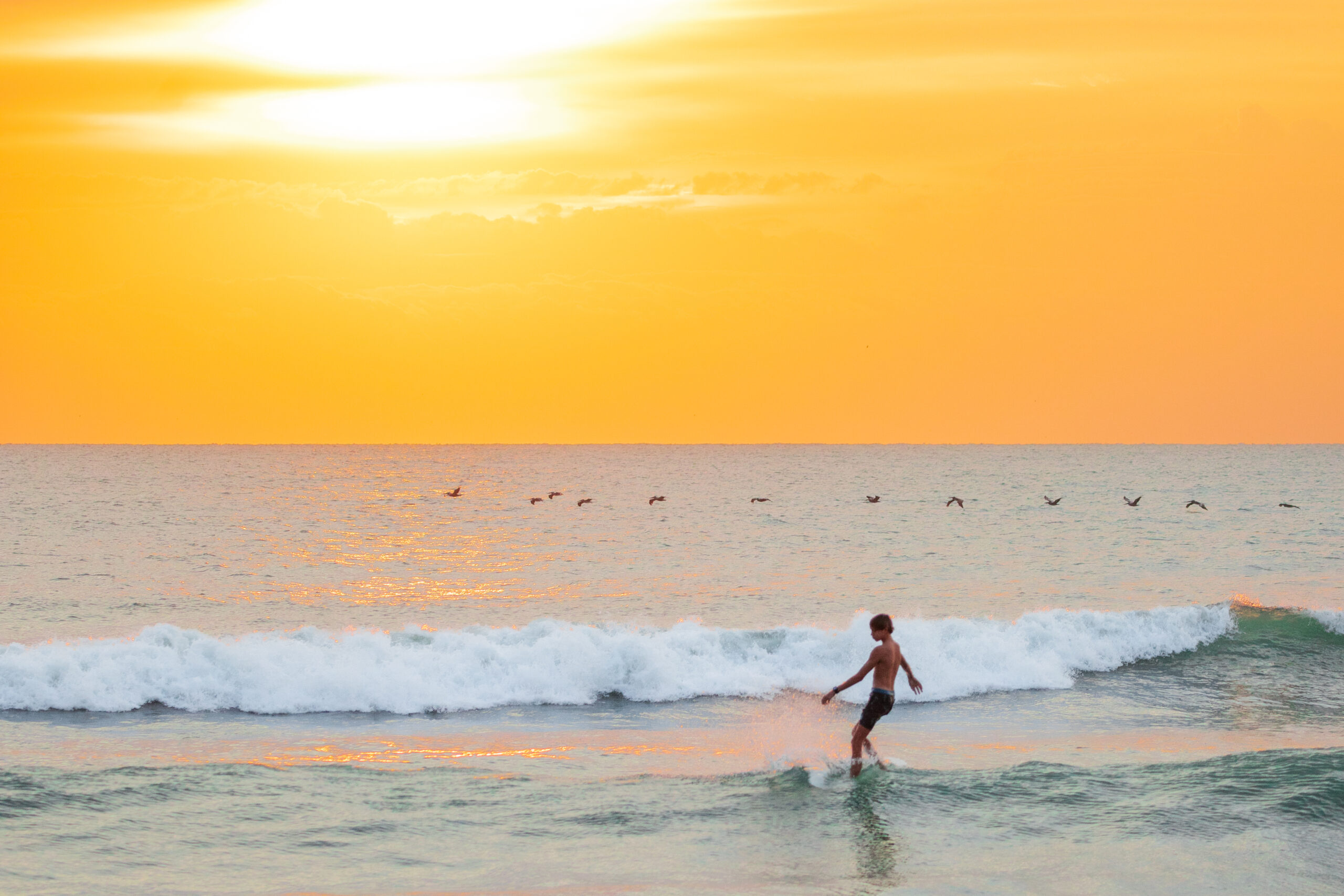 sunrise surfer
